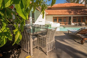 One of the outside dining tables near the pool.