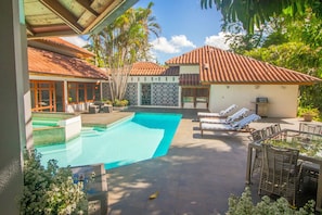 Beautiful patio with a pool and jacuzzi.