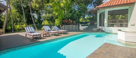 Beautiful patio with a pool and jacuzzi.