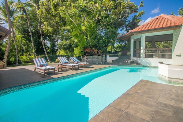 Beautiful patio with a pool and jacuzzi.