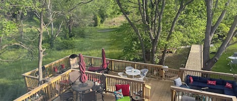 Backyard oasis! Multi level deck, gravel solar lit walkway to fire pit/games