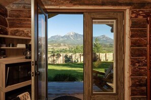 Majestic mountain views from inside Macy's Muse cabin. Sit. Relax. Enjoy