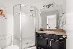 Full size bathroom with a new shower
