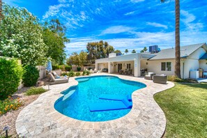 This backyard oasis is furnished with Pottery Barn outdoor furniture
