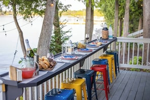 Pull up a chair and enjoy a sunset dinner over the water.