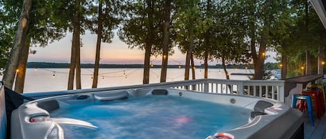 Unwind and relax in the 6 person hot tub overlooking the water.