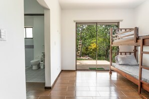 Bedroom with a bunkbed of twin beds and an inside bathroom.