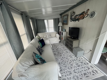 Sunroom/living room
2 full size sleeper sofas