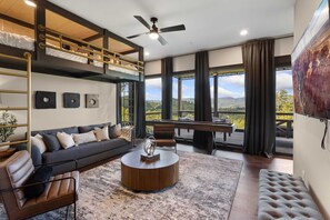 Lower Level Bonus Room with Suspended Bunk Beds, Shuffleboard, and Hot Tub Deck