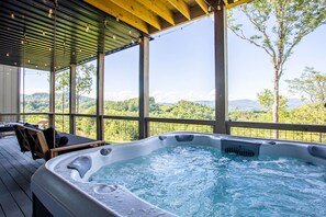 Lower Level Hot Tub Deck with Swinging Bench and Hanging Edison Lights