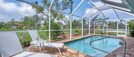 Sparkling pool with garden space behind the house