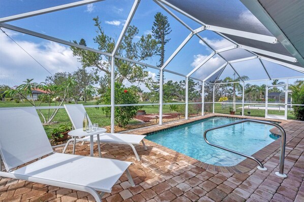 Sparkling pool with garden space behind the house