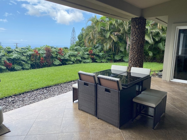 Private garden lanai with ocean view.