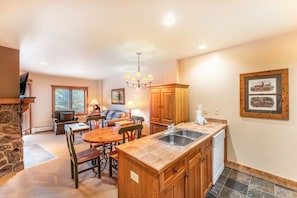 Open concept kitchen, dining and living area.