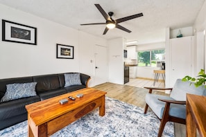 Living room next to kitchen area