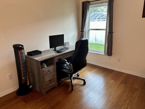 Desk, with stand up top. Black out Curtains 