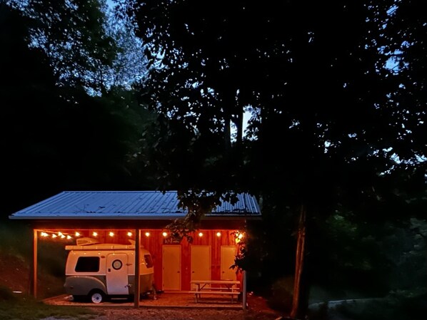 Camper at dusk from fire pit