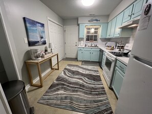 Well equipped kitchen w/ coffee bar. Utility closet with full size washer/dryer.