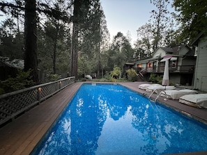 Spacious backyard pool area/lower yard - fenced off from deck.