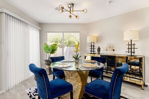 Set in the heart of the home is the modern dining room. Sleek lines, a calming color palette, and an abundance of natural light create an atmosphere of serenity where conversations flow over shared meals.