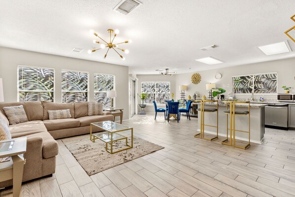 Adjacent to the dining room, the living area offers a comfortable setting for relaxation!