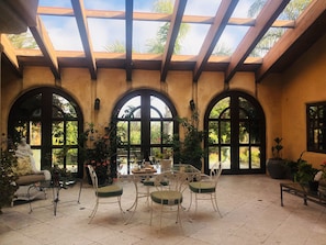 Gorgeous Atrium and sitting area in front of the property's entrance. 