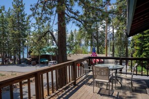 You will love relaxing on the balcony where you can enjoy the fresh mountain air and views of the lake through the trees.