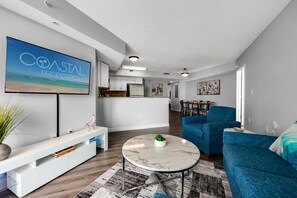 A large flat-screen TV and entertainment center offer entertainment options for cozy nights in.