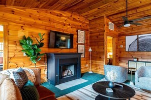 Feel cozy in the modern cabin feel while relaxing by the fire.