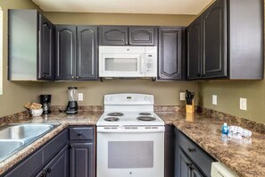 Our kitchen is a perfect blend of style and functionality. It boasts luxurious granite countertops and modern stainless steel appliances. Cooking has never been this glamorous!