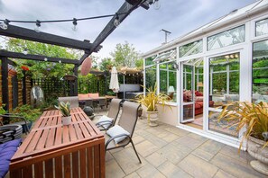 Courtyard with hot tub, fire pit and seating
