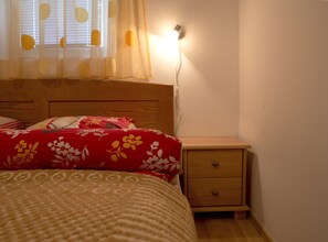 Comfy bed in first bedroom.