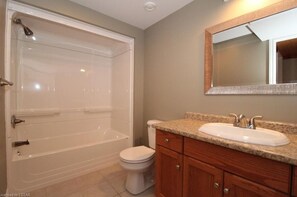 Bath tub in wash room on lower floor