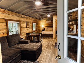 View of Hickory Cabin's living room and bedroom