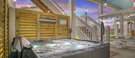 Private hot tub w/lights is part of the fun and relaxation on the ground floor.