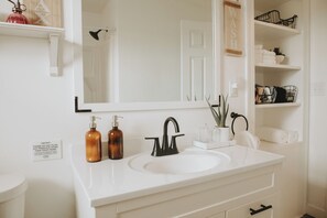 Well-appointed and stocked bathroom with modern fixtures.