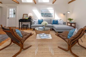 Living Room Has Vaulted Ceilings and Skylights