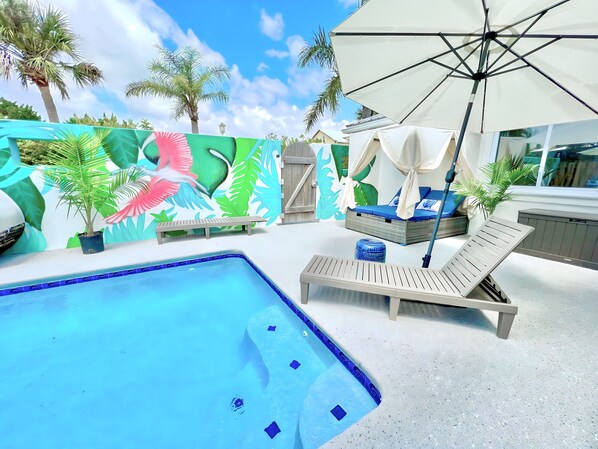 Lounge by the gorgeous pool and enjoy the ocean breeze from the cabanas.