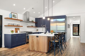 Gourmet chef's kitchen with dual-fuel Bertazzoni range and column fridge