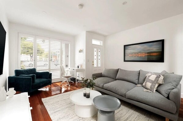 TV area with comfy sofa seats and study space