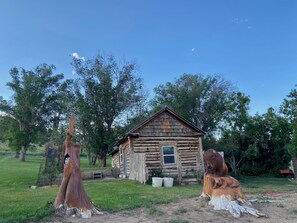 Side cabin  with tree carvings
