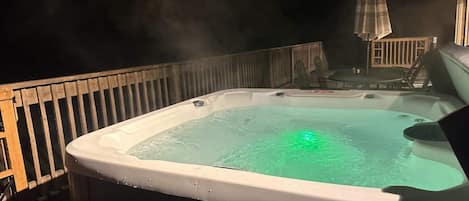 Hot tub on the front deck in the evening