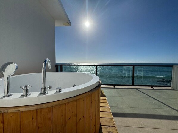 Serene Oceanfront Terrace with Private Jacuzzi
