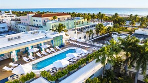 CasaGrandeSouthBeach (top of photo), next door Tiffany Rooftop Bar with heated pool access from $25/pp with DayPass featuring Poolside Bar/Food/Beverage, Towel service, Wifi (subject to availability & price fluctuation), next to News Cafe.