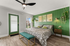 Unwind in a chic lime-themed retreat with a king bed, cozy seating & workspace!