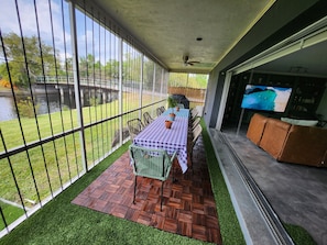 Patio with table seating for 10 people, living room sliding doors can fully open