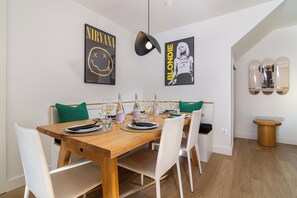 Dining area with a brand new dining table and comfortable seating. 