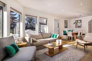 Open space living and dining area with plenty of natural light. 