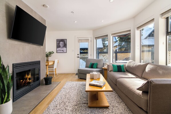 Wood-burning fireplace, foldable lounge chair, queen-size sofa bed, and patio. 