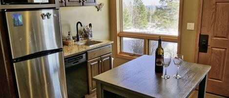 Kitchenette and small dining table. 